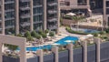 Luxury swimming pool on roof top during amazing sunny day aerial timelapse. Royalty Free Stock Photo