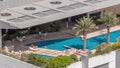 Luxury swimming pool on roof top during amazing sunny day aerial timelapse.