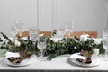 Luxury table setting with beautiful decor and blank cards indoors. Festive dinner Royalty Free Stock Photo