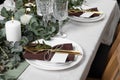 Luxury table setting with beautiful decor and blank cards. Festive dinner Royalty Free Stock Photo