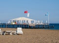Luxury tent with sun beds on the pier, beach holidays in Turkey
