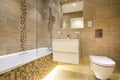 Luxury three piece bathroom in beige - brown Royalty Free Stock Photo