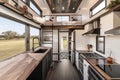 luxury tiny house with modern interior and amenities, including stainless steel appliances and marble countertops