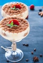 Luxury tiramisu dessert in a cocktail glass decorated with cocoa