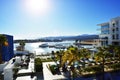 Luxury tourist resort with swimming pool and palm-trees near the sea Royalty Free Stock Photo