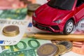 Luxury toy car on Euro cash with calculator Royalty Free Stock Photo