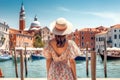 Luxury travel woman looking panorama. Sun hat maxi dress woman relaxing sea view in Venice, Italy. Destination Europe. Concept web Royalty Free Stock Photo