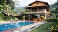 Luxury tropical villa with swimming pool and lush garden in a mountain setting