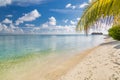 Luxury vacation. Summer beach in Maldives island, palm leaf and water villas. Amazing scenery, sea and white sand under blue sky