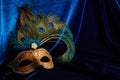 Luxury venetian mask on dark blue background. Carnival masquerade fantasy mask