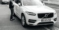 Luxury Volvo XC90 parked on French city with owner approaching Royalty Free Stock Photo