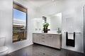 Luxury washroom with a window beside a bowl