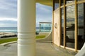 Luxury waterfront building entrance with door and pillar on beach Royalty Free Stock Photo