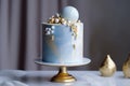 Luxury wedding cake on table, blue and gold frosting. Generative AI Royalty Free Stock Photo
