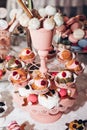 luxury wedding catering, table with modern pops desserts, cupcakes, sweets with fruits. delicious candy bar at expensive wedding Royalty Free Stock Photo