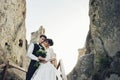 Luxury wedding couple is hugging each other in mountains