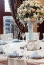 Luxury wedding decor with flowers and glass vases and number of Royalty Free Stock Photo