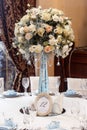 Luxury wedding decor with flowers and glass vases and number of Royalty Free Stock Photo