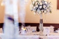 Luxury wedding decor with flowers and glass vases and number of Royalty Free Stock Photo