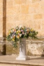 Luxury wedding floral decorations at the entrance of Ostuni church. Royalty Free Stock Photo