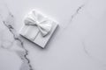 Luxury wedding gifts with silk bow and ribbons on marble background Royalty Free Stock Photo