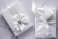 Luxury wedding gifts with silk bow and ribbons on marble background Royalty Free Stock Photo