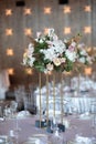 Luxury wedding table setting with flower centerpieces and candles Royalty Free Stock Photo