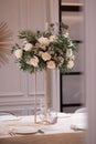 Luxury wedding table setting with flower centerpieces and candles Royalty Free Stock Photo