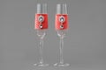 Luxury wedding wine glasses decorated with velvet cloth in coral color Royalty Free Stock Photo