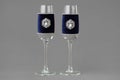 Luxury wedding wedding wine glasses decorated with velvet cloth and jewelry.