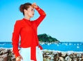 Woman standing in front of lagoon looking into distance, Spain Royalty Free Stock Photo