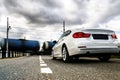 Luxury white car waiting at the railway crossing