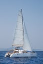 Luxury white catamaran boat in the ocean.