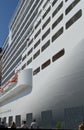 Luxury white cruise ship on blue sky background close-up
