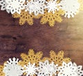 Luxury white and golden snowflakes on dark wooden background. Winter, Christmas, New year concept. Rustic Royalty Free Stock Photo