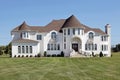 Luxury white home with front turret Royalty Free Stock Photo