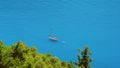 Luxury white sailing yacht in the open blue bay. Vacations in mediterenean sea. Secluded Islands in Greece. Travel