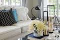 Luxury white sofa in living room with flower in vase