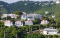 Luxury White Stucco Condos on Green Tropical Hillside