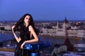 Luxury woman in evening dress with view on city. girl in elegant dress. Modern life with princess in celebrity Royalty Free Stock Photo