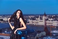 Luxury woman in evening dress with view on city. Sexy girl in elegant dress. Modern life with princess in celebrity Royalty Free Stock Photo