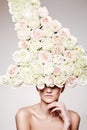 Luxury woman with a rose hat in fashion model pose Royalty Free Stock Photo