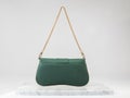 Luxury women 's bag. Luxury green leather handbag on white background, on marble floor Royalty Free Stock Photo