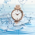 Luxury women`s watch in water splashes demonstrating its waterproof Royalty Free Stock Photo