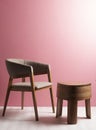 Luxury wooden chair with polished wooden table with three legs in a space with pink wall and cream floor with ambient light Royalty Free Stock Photo