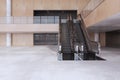 Luxury wooden and concrete empty shopping mall interior with escalator. Large public interiors concept.