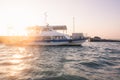 Luxury yacht docked on the shore against sunset
