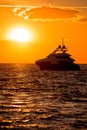 Luxury yacht on open sea at golden sunset Royalty Free Stock Photo