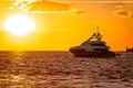 Luxury yacht on open sea at golden sunset Royalty Free Stock Photo