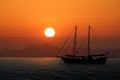 Luxury yacht in the sea with red sky sunset Royalty Free Stock Photo